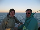 IMG_1960  Tracy and Bob on evening cruise from Monkey Mia.  We are getting far enough south for it to be cold and windy.JPG