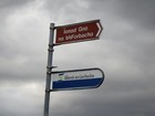 IMG_3706  This is a Gaeltacht or Gaelic speaking area.  The lower sign is to a government support agency for Gaelic businesses.JPG