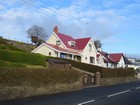 IMG_4101  Ginger Cottage, on the right, across from Ginger Meadow, in Ballygally.JPG